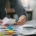 Trust filing season: Trustee organizing documents with colorful markers for 2025 tax filing.