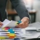 Trust filing season: Trustee organizing documents with colorful markers for 2025 tax filing.