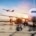Aircraft being refueled on runway at sunrise, symbolizing international travel and expatriate movement.
