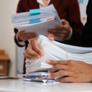 Trustees who meet to review compliance and tax obligations for their trust